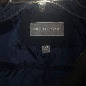 This is a Navy blue Michael kors men’s parka coat!
